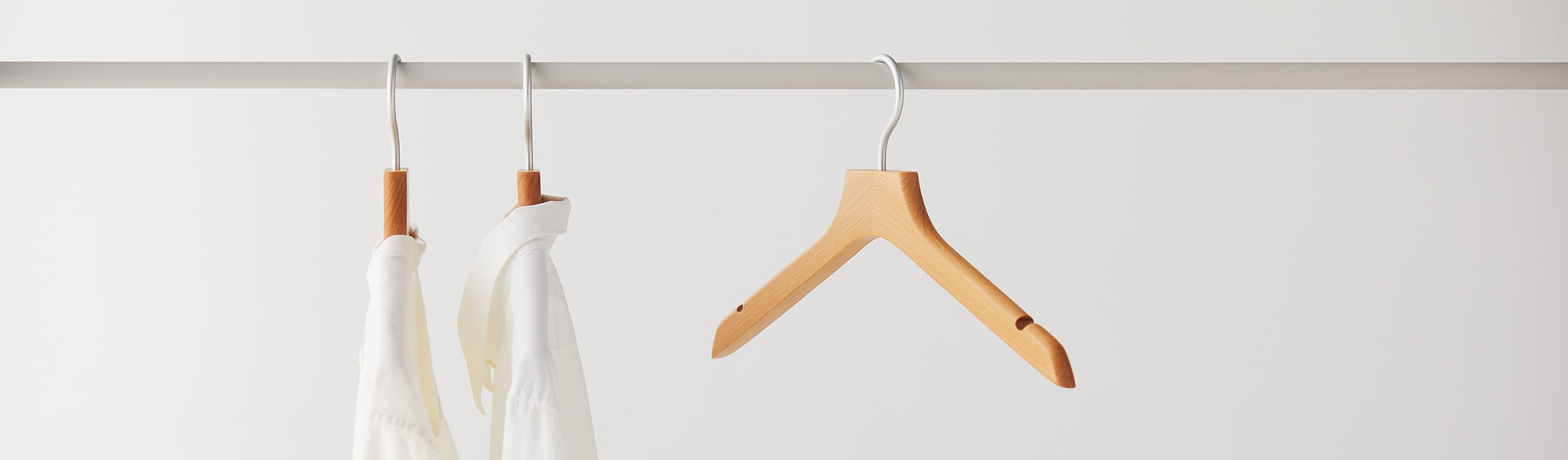 Hooks & Hangers Banner-3 wooden hangers with 2 in use 