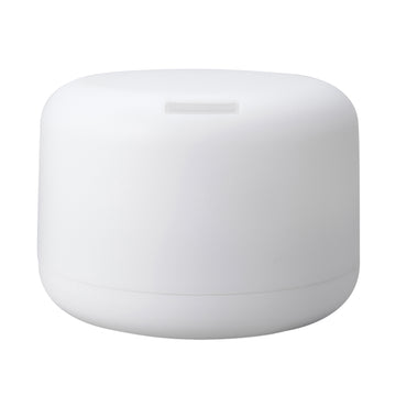 A white, cylindrical plastic diffuser or humidifier container with a small rectangular slot on top, shown against a plain white background.