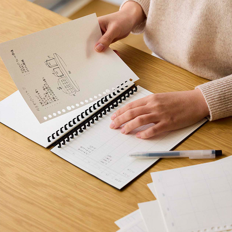 Person flipping through binder