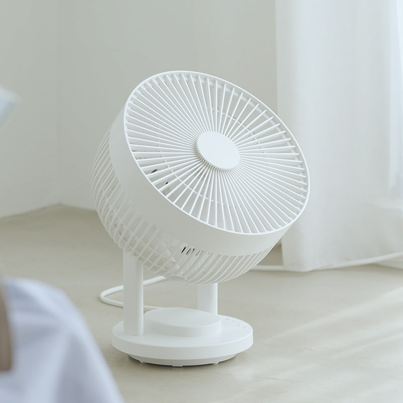 Oscillating Circulator Fan on wood floor. 