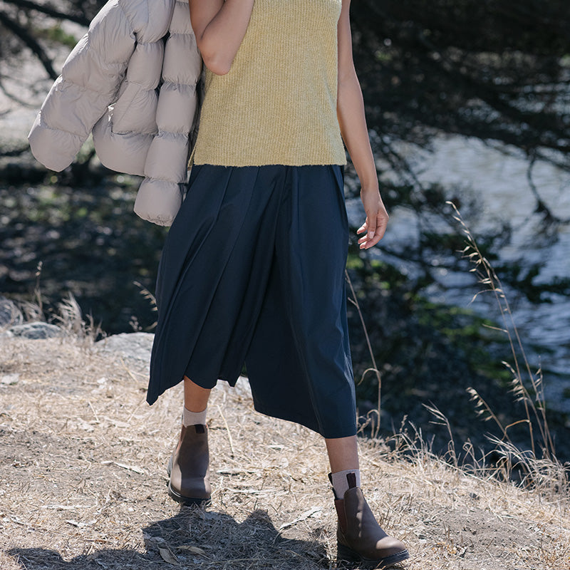Women's Navy Hakama pant, person mid stride. 