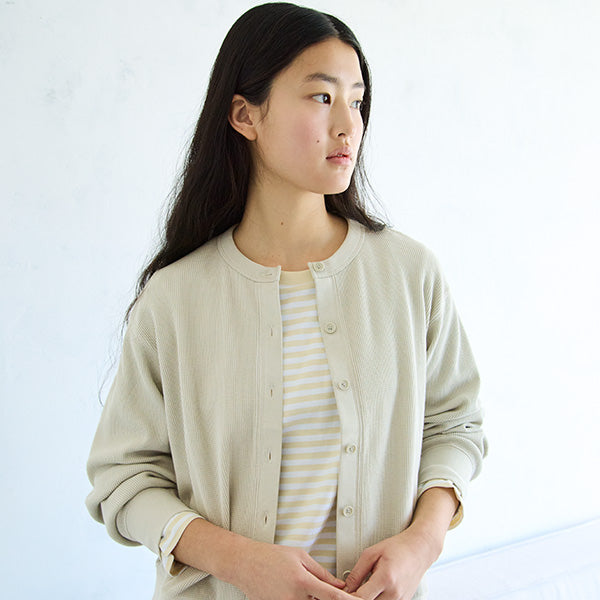 Woman wearing a cardigan. 